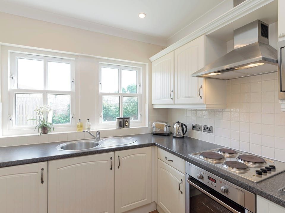 Well-equipped fitted kitchen | Embleton Cottage, Beadnell