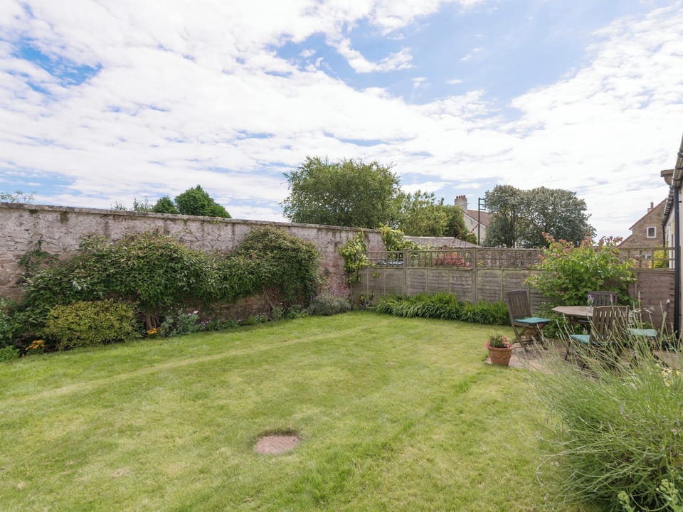 Enclosed lawned rear garden | Embleton Cottage, Beadnell