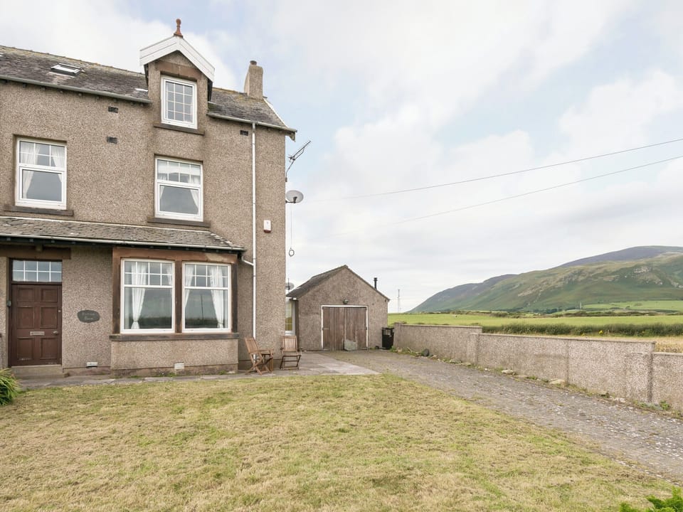 Lawned garden and off road parking | Hartrees House, Silecroft