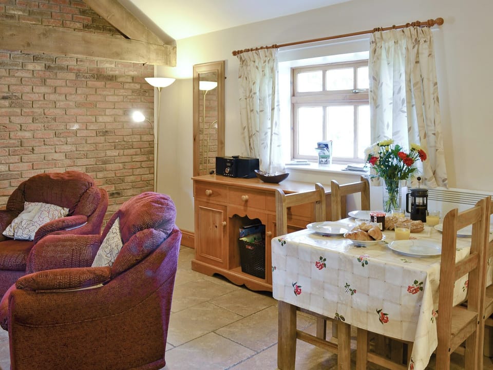 Intimate dining area in open-plan room | Ilingworth Cottage - Filey Holiday Cottages, Filey