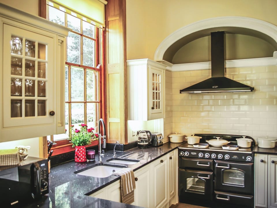 Modern farmhouse kitchen with wood burning stove and range cooker | The Farmhouse at Gradbach, Gradbach near Buxton