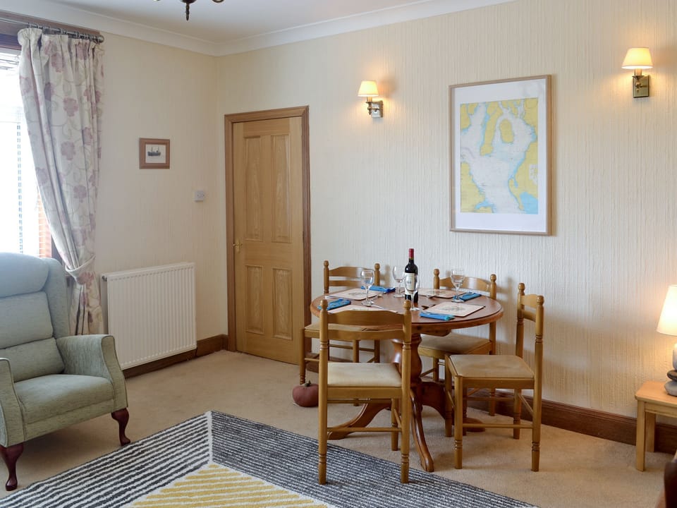 Convenient dining area within living room | Anchorage, Maidens