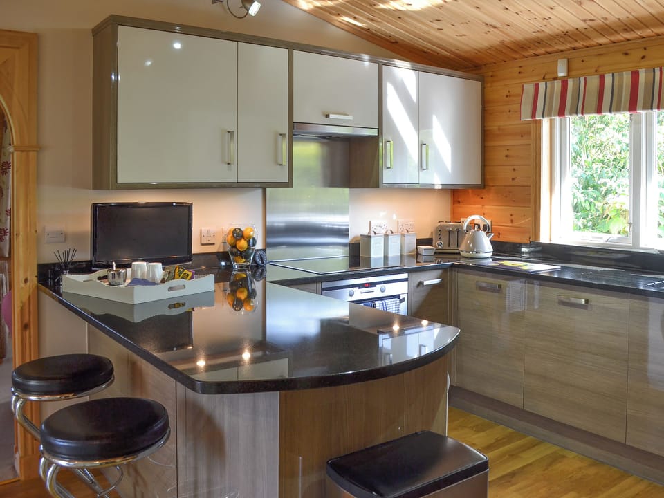 Well appointed kitchen with breakfast bar | Wheal Metal Lodge, Poldown, near Helston