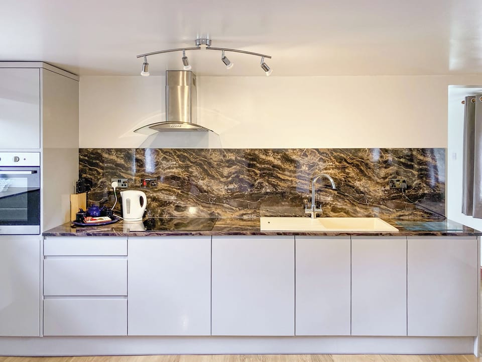 Kitchen area | The Milking Parlour - Harbut Law Holiday Cottages, Alston