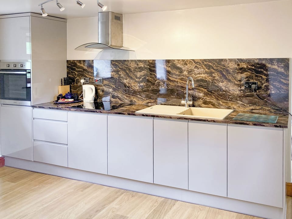 Kitchen area | The Milking Parlour - Harbut Law Holiday Cottages, Alston