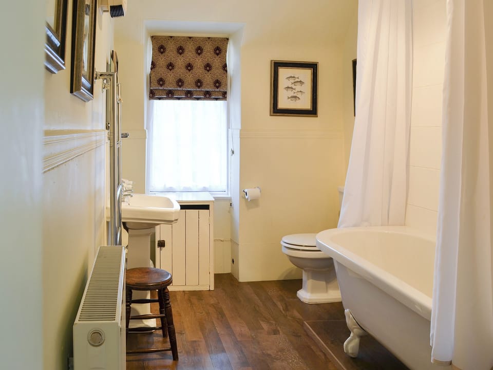 Bathroom with wooden floor and shower over the bath | Einich, Newtonmore, near Aviemore