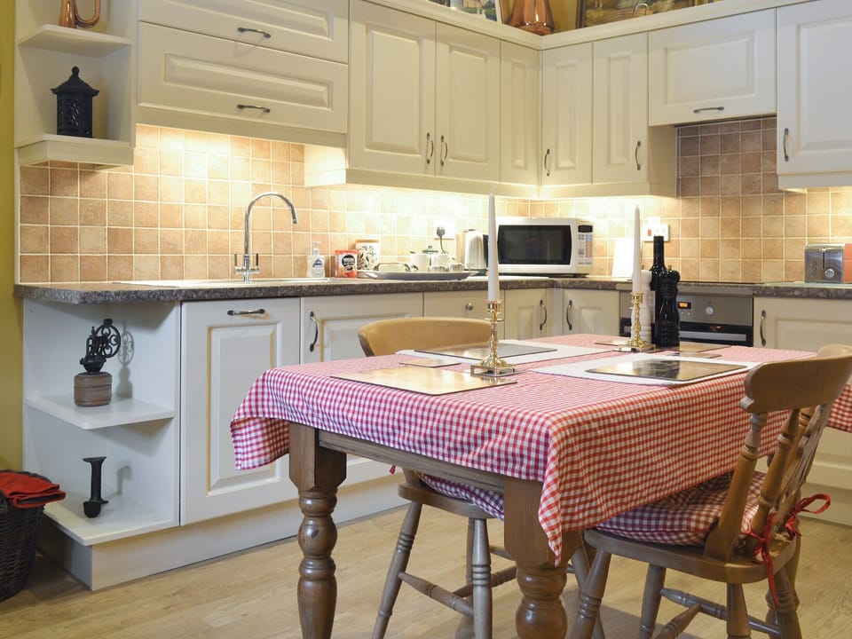 Fully appointed kitchen with convenient dining area | Old Barn Cottage, Lockton near Pickering