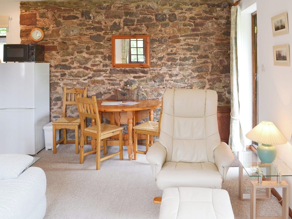 Modest dining area with exposed stone wall | The Berry - Cobblestones, Marldon, near Paignton