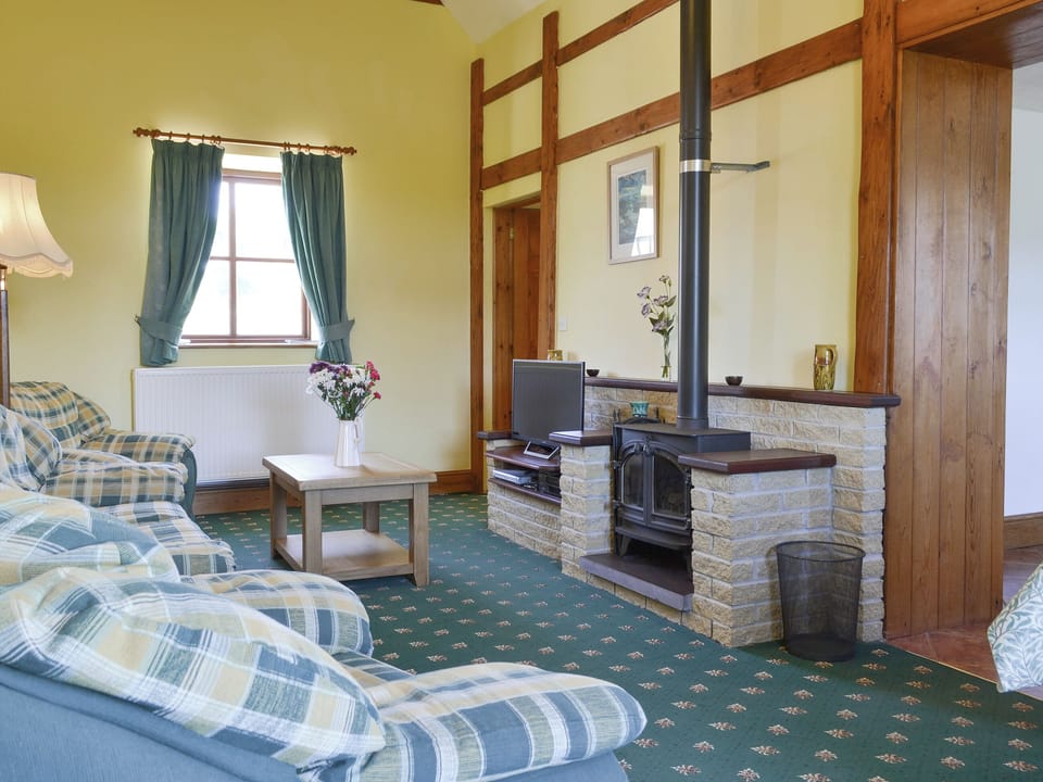 Characterful living and dining room with wood burner | Dwyfor - Aberkin Farm, Llanystumdwy, near Criccieth