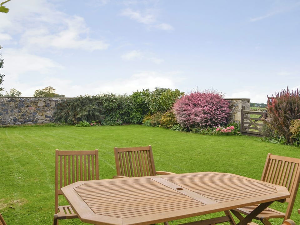 Enclosed lawned rear garden | Hume Orchard Steading, Hume, near Kelso