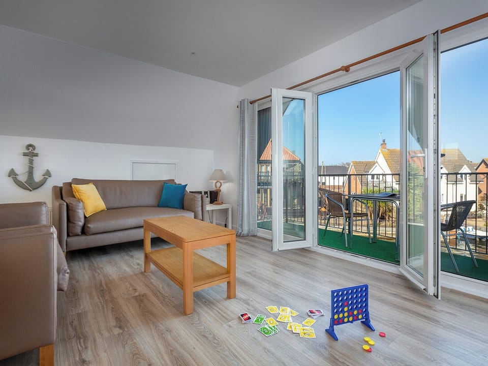 Spacious living area with French doors to balcony | Grebe - Daisy Broad Lodges, Wroxham