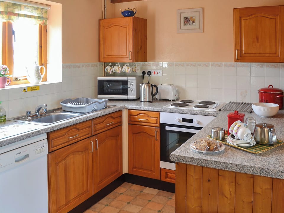 Modest kitchen adjoining the living area | Merlin View - Higher Lanvean Farm, St Mawgan, near Newquay