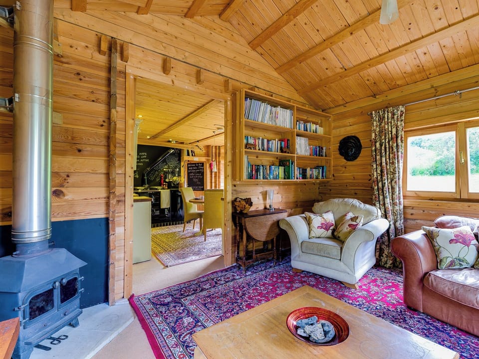 Cosy living room with wood burner | Ash Mill Cabin, Ashreigney, near Chulmleigh
