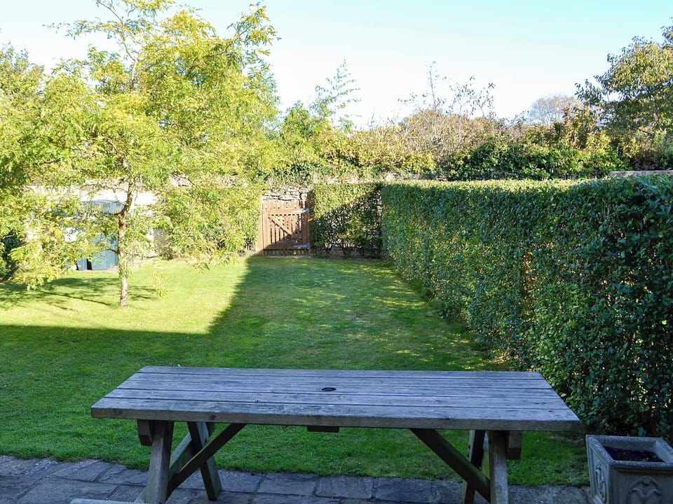 Paved patio with picnic style seating | Carters Cottage - The Old Timberyard, Puncknowle, near Dorchester