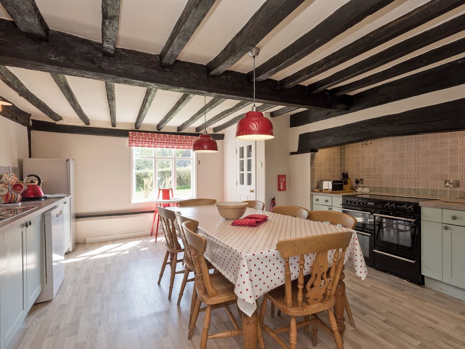 Traditional farmhouse kitchen/dining area with electric range | Cravens Manor, Henham, near Southwold
