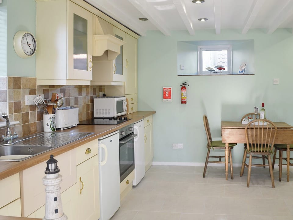 Well equipped kitchen/ dining area | Aidan Cottage, Craster, near Alnwick