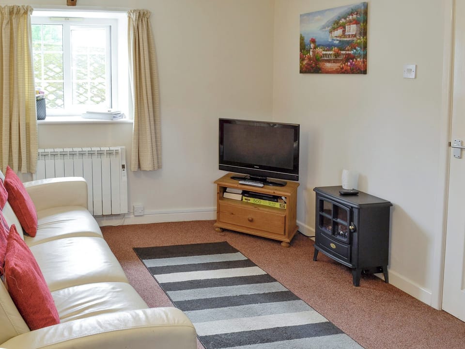 Cosy seating area | Foxglove Cottage - Dairy Farm Cottages, Wootton Fitzpaine, near Charmouth