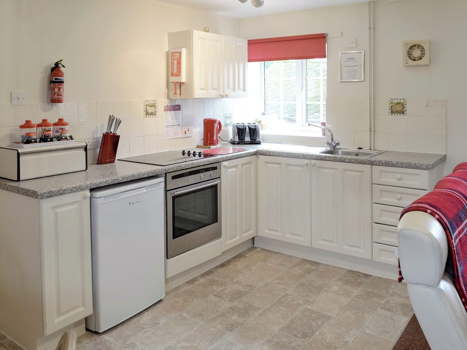 Well-equipped fitted kitchen area | Foxglove Cottage - Dairy Farm Cottages, Wootton Fitzpaine, near Charmouth
