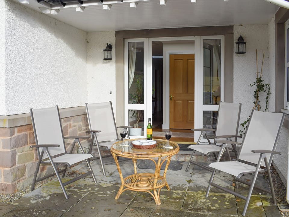 Covered seating area at main entrance | Heather Croft - Hatton Cottages, Dunkeld, near Pitlochry