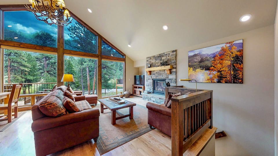 living area with gas fireplace and river views