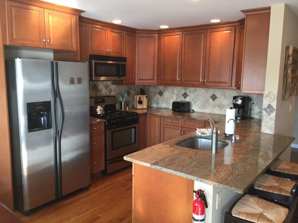 New kitchen is well equipped with nice china, glassware, appliances & gas stove
