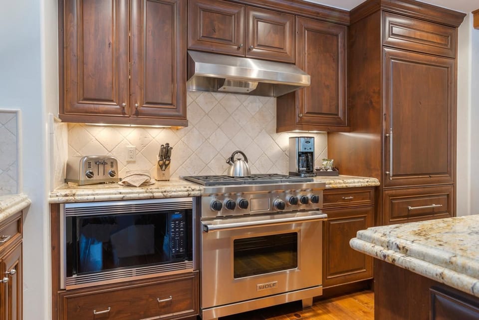 Gourmet kitchen with stainless steel appliances and granite countertops