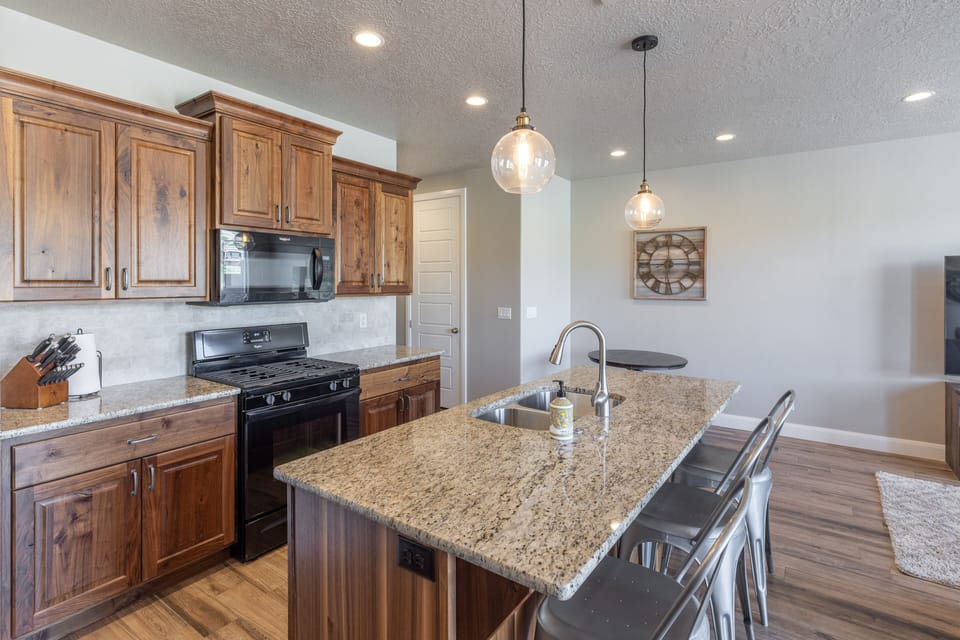Kitchen Island - The Kitchen Island comfortably seats 3 adults and creates a great space for serving and preparing meals.