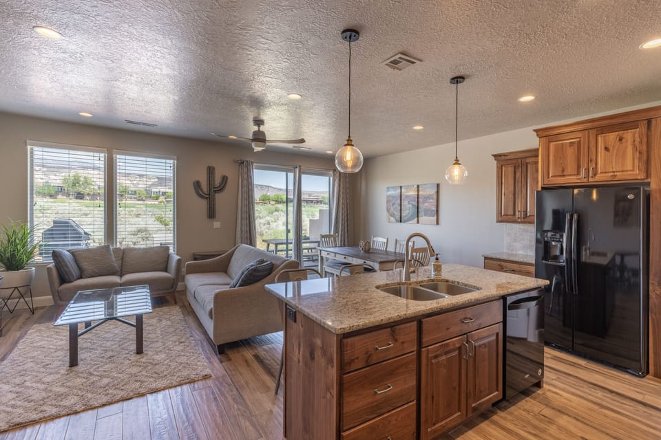 Kitchen View - This area is designed as an open floor plan and is a great gathering place for meals, games, or watching TV during your stay.