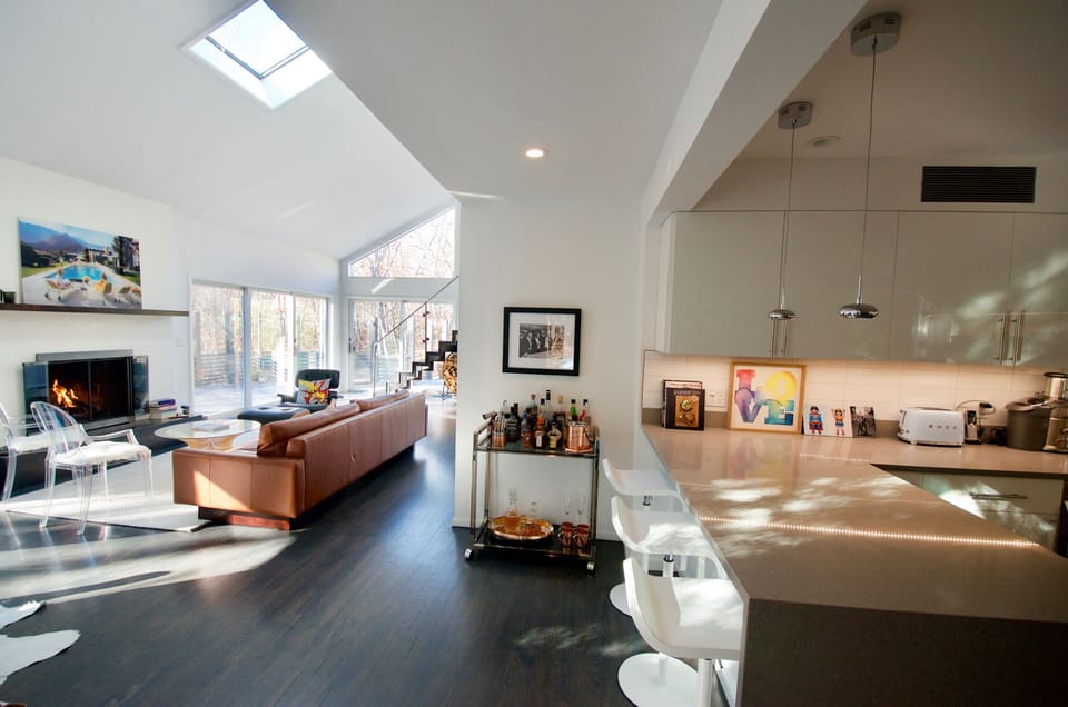 Living room with fireplace and views to back of house
