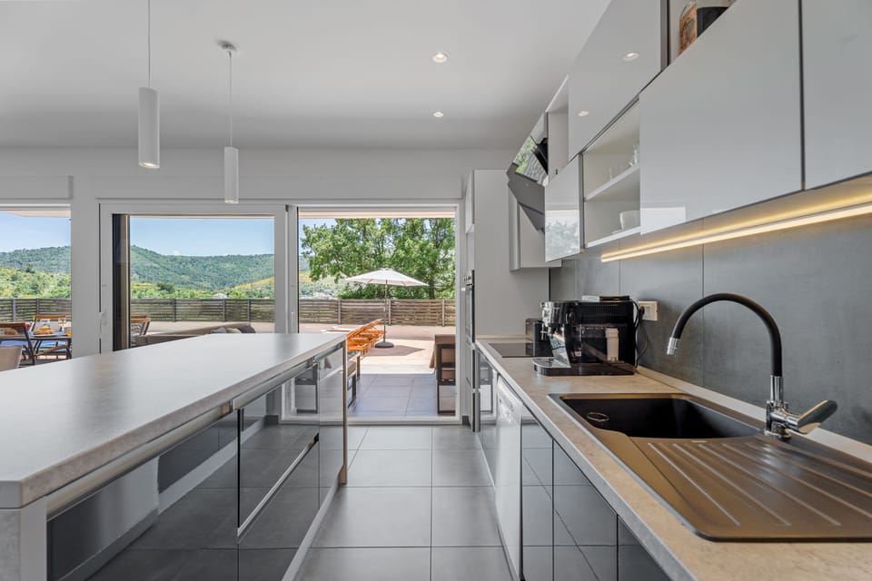 Fully equipped kitchen with all the amenities guest needs for comfortable stay