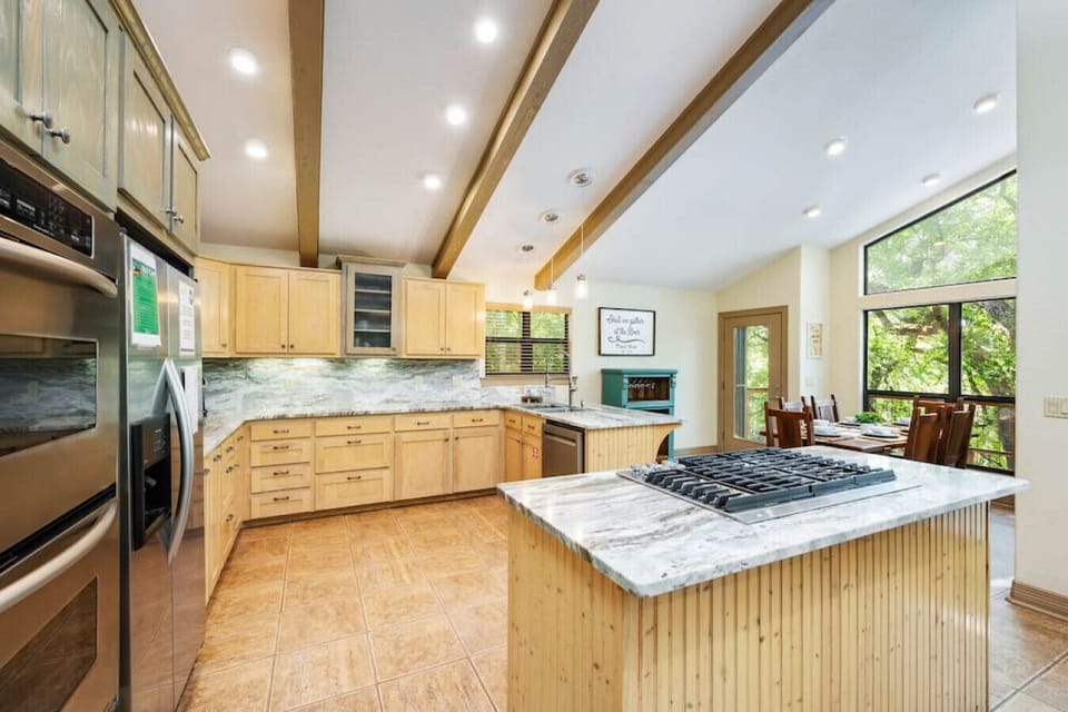 Cook, dine, and unwind with stunning Comal River views just beyond the kitchen