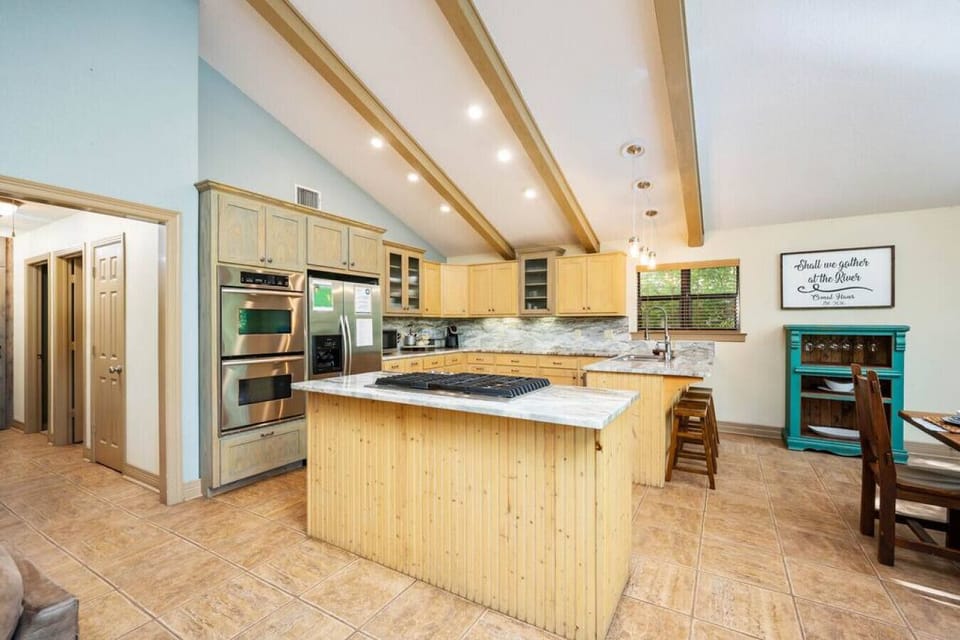 Cook, dine, and unwind with stunning Comal River views just beyond the kitchen