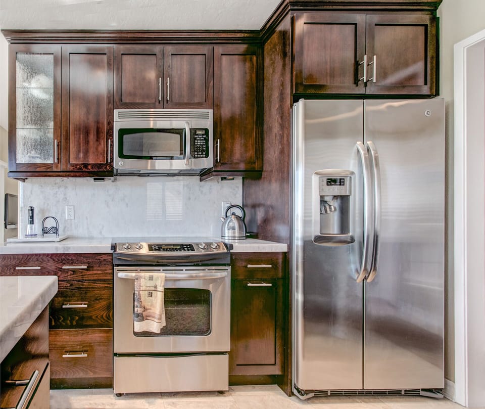 Beautifully modern kitchen with stainless steel appliances.