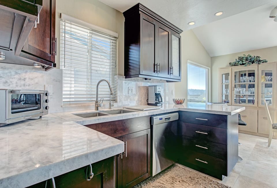 Kitchen with dishwasher, toaster oven and regular coffee maker