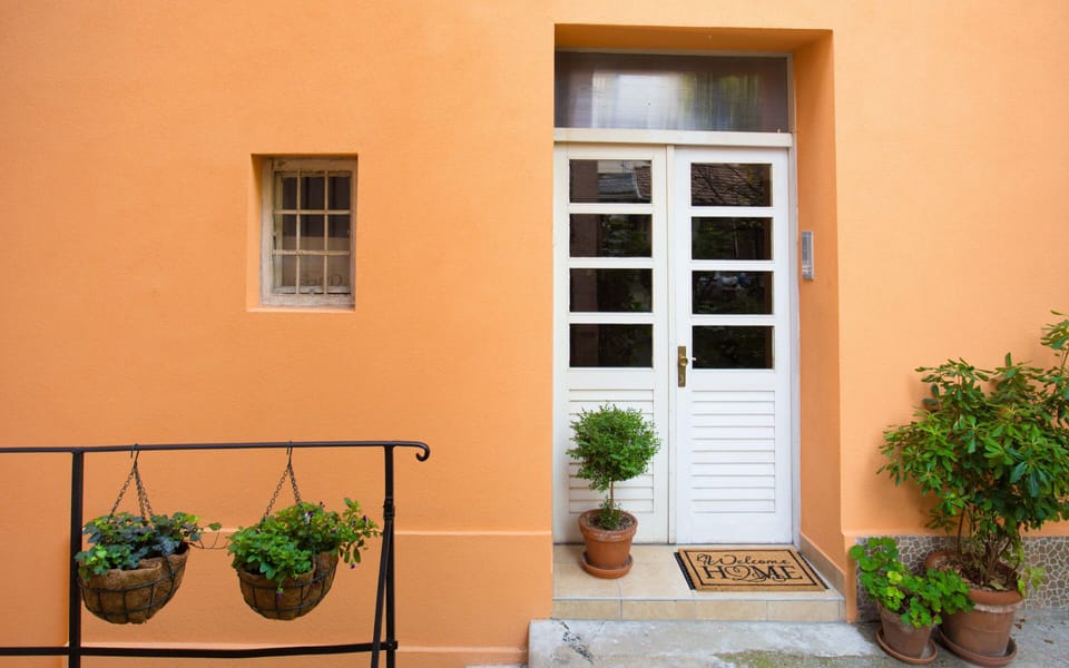 Building entrance from the garden. Apartment is one floor up from here.