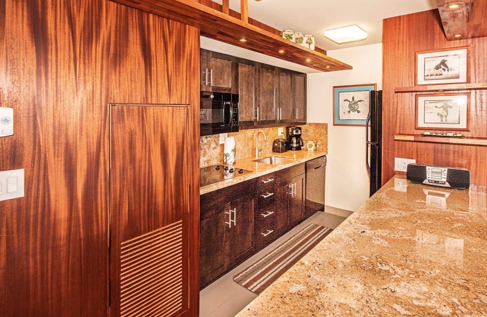 Gorgeous African mahogany paneling and a clean well supplied and clean kitchen.