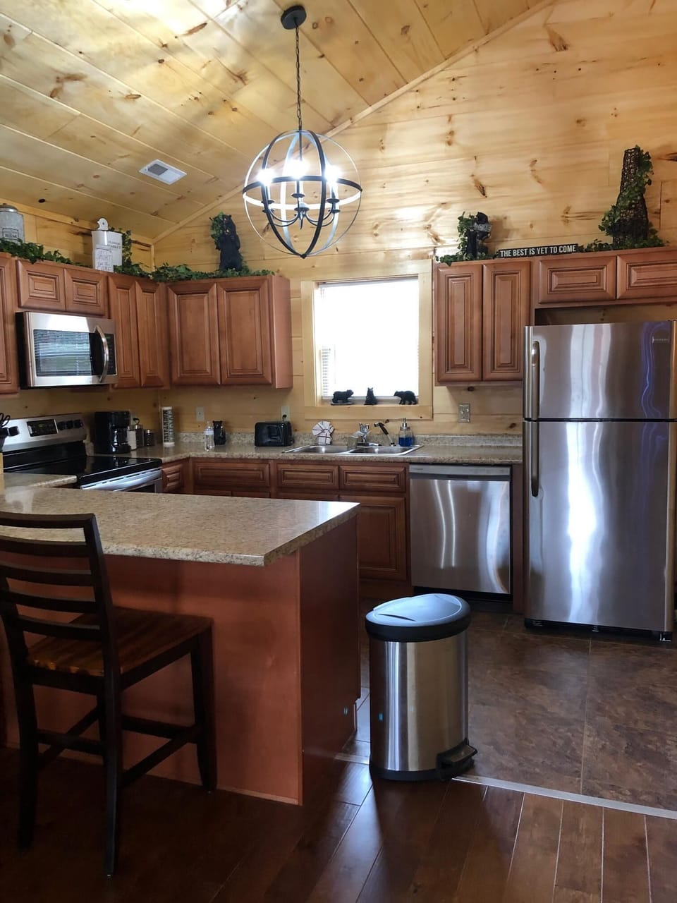 rustic chandeliers throughout  in full equip kitchen