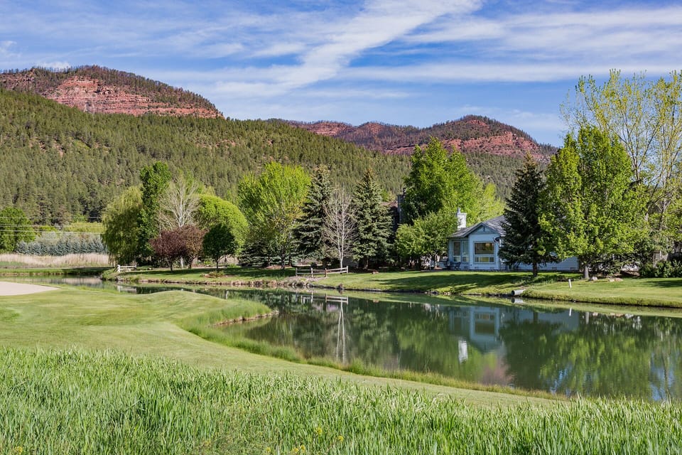 Exterior view of the back of the home across the 12th fairway