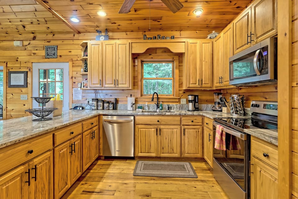 Fully equipped kitchen with new stainless appliances and granite counter tops