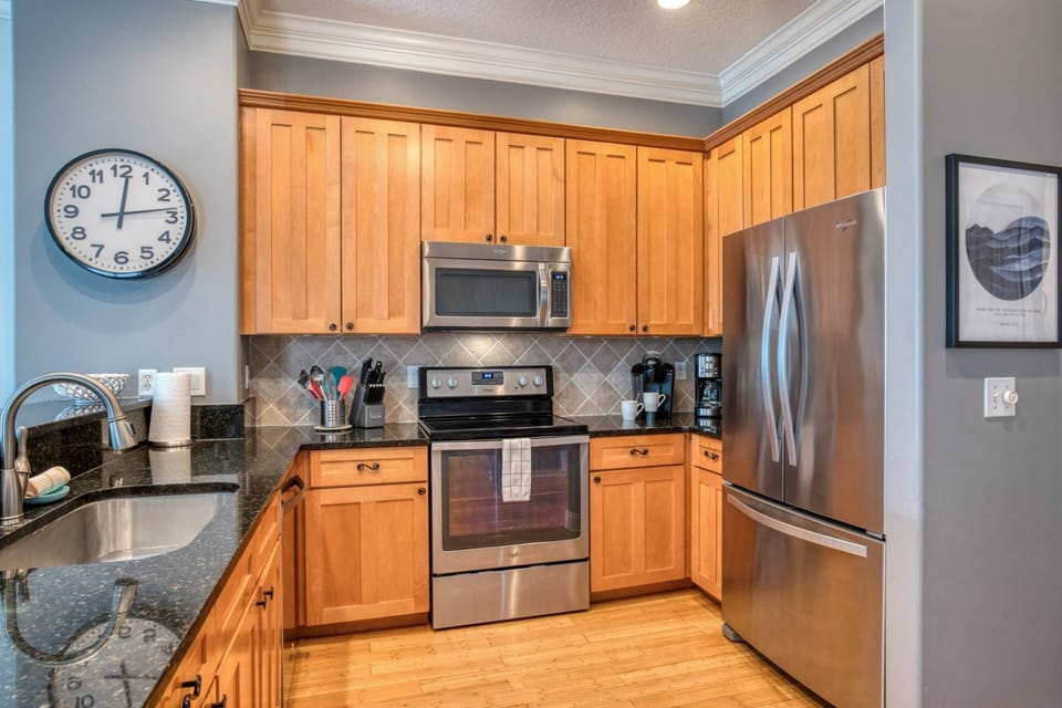 The kitchen is neat, clean and well-stocked with all you need to "cook at home."