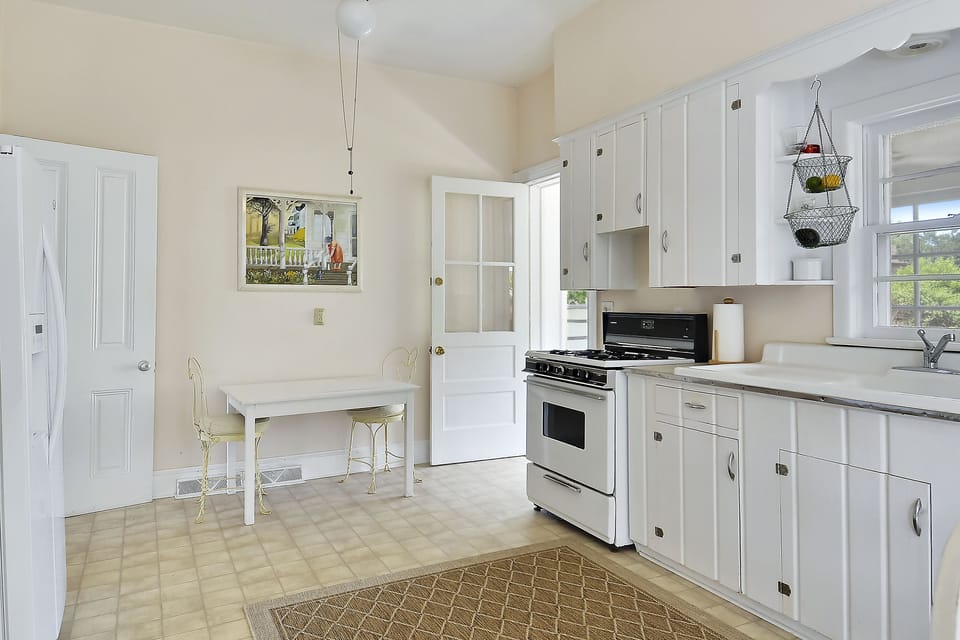 Table space kitchen with door to rear porch