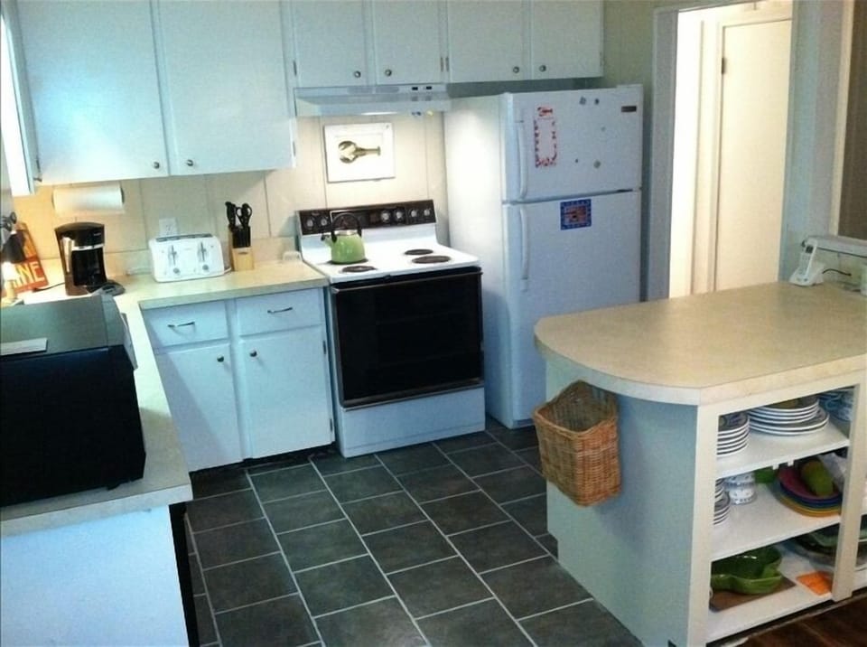 Bright, well-equipped kitchen has everything you'll need for summer living.