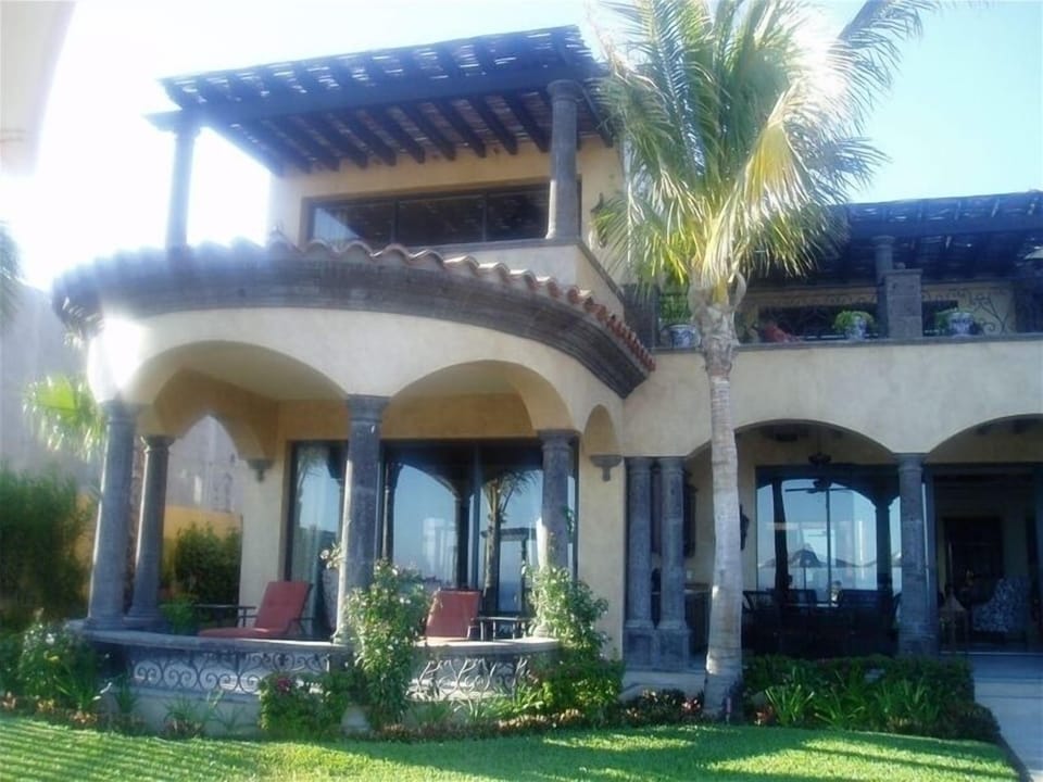 Back view of home looking at 3 bedrooms with terraces