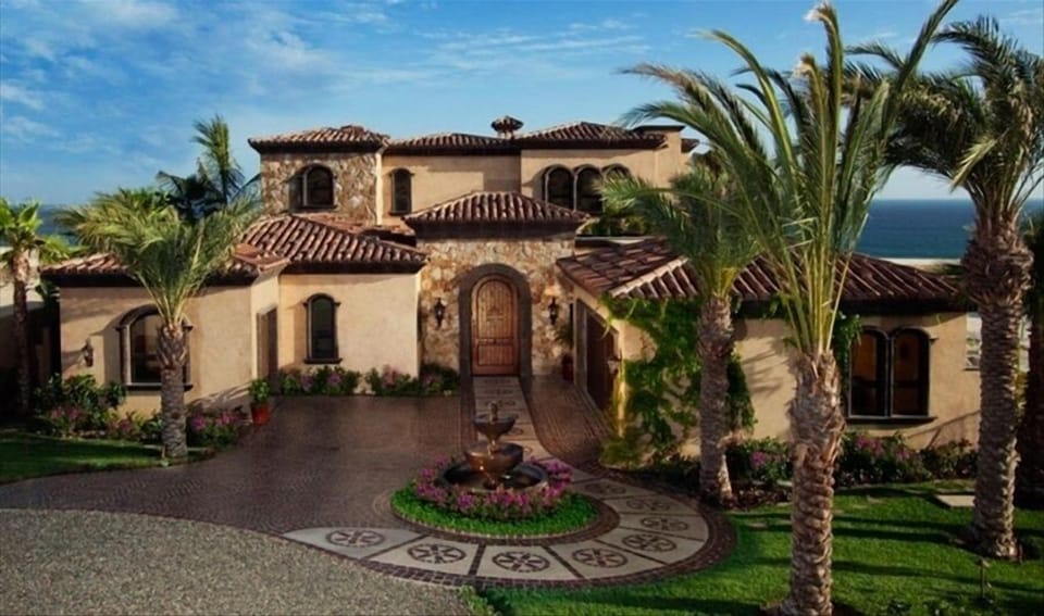 Front view of home with 2-car garage and mini garage attached.