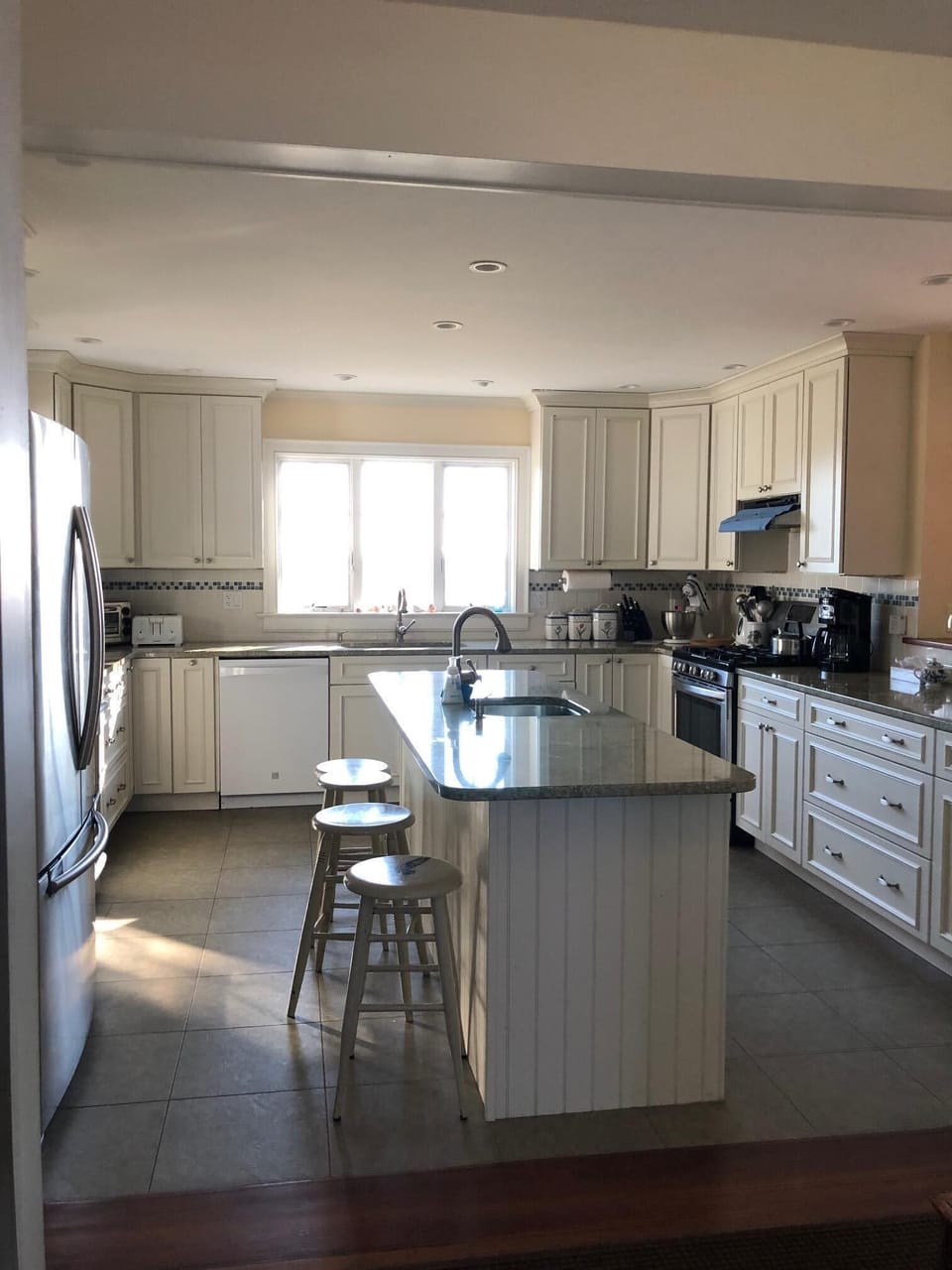 Recently renovated kitchen with granite counter tops, island, 2 stoves, 2 sinks 