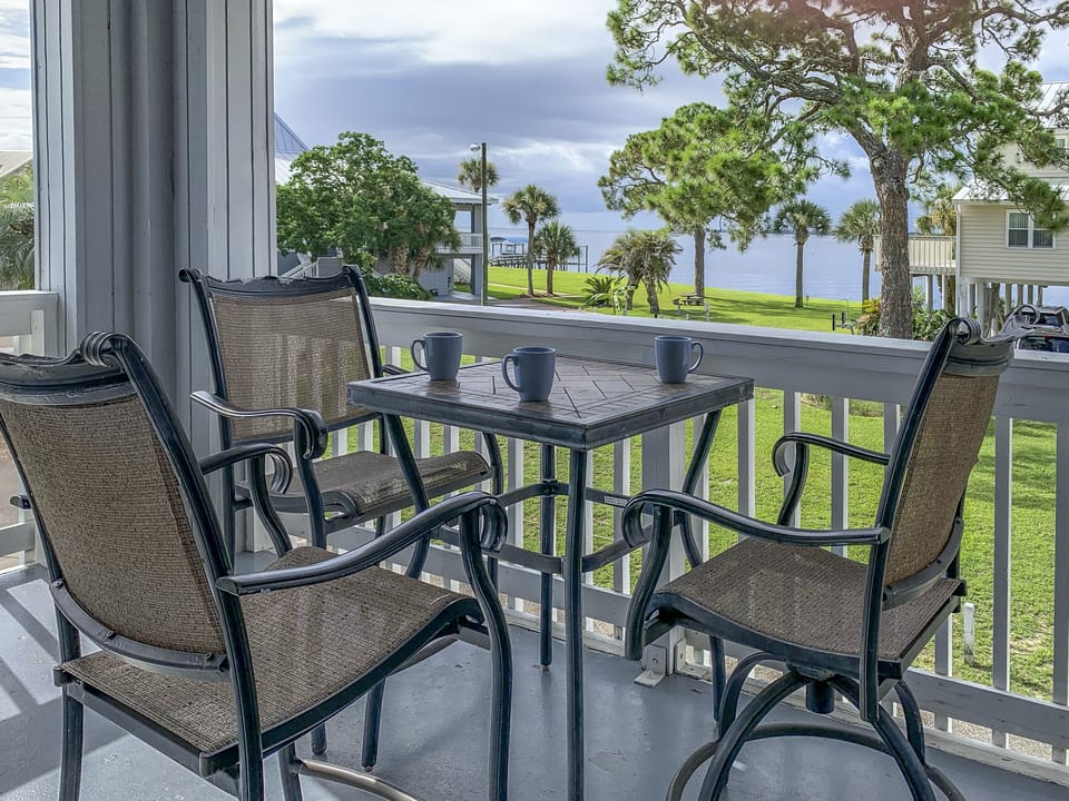Ochlockonee Bay view from wrap-around balcony, table and 3 chairs