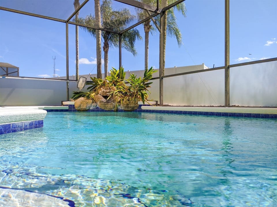 Large Pool and Spa with Rock Fountain Landscape Feature