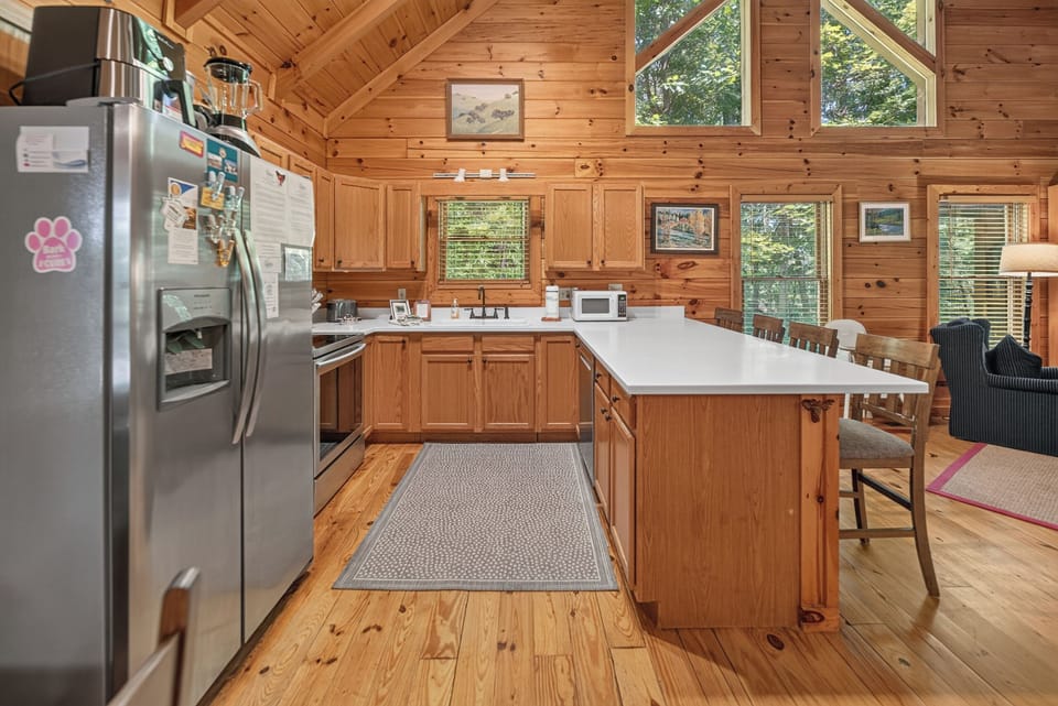 Rustic kitchen with high ceilings and a spacious island for family gatherings.