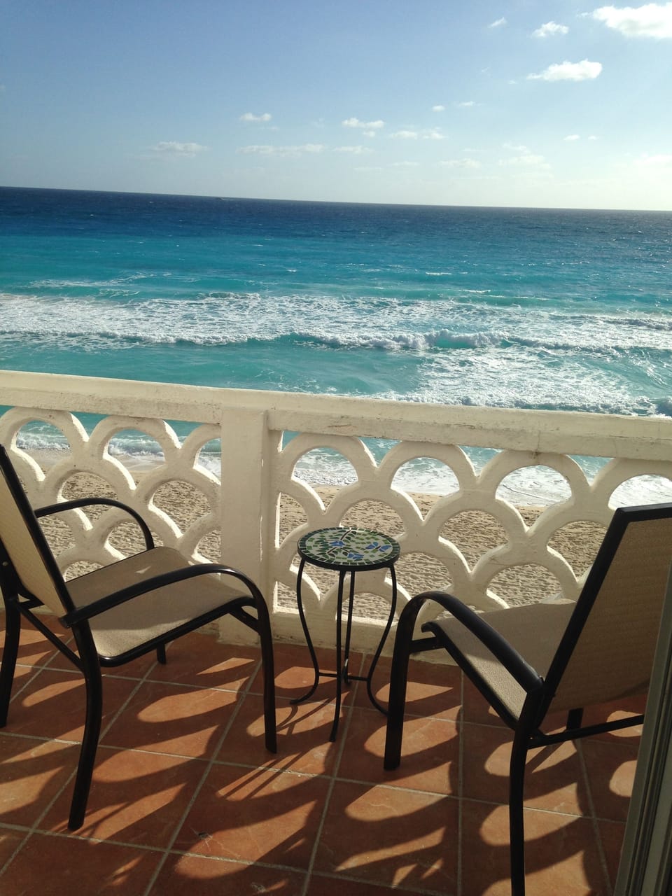 Coffee, meals, people watching, a night cap, etc., all on newly tiled balcony.