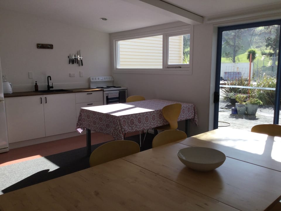 A spacious kitchen and dining room with large deck for your enjoyment
